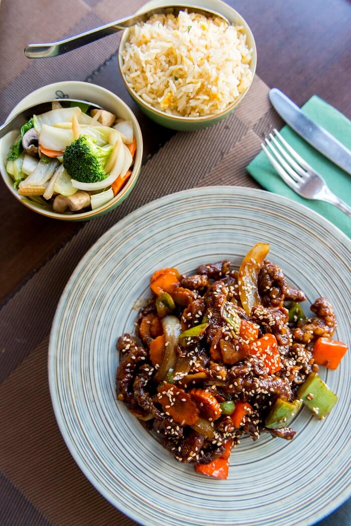 Sen Tonkin, Crispy Beef with mixed vegetables in sweet and sour sauce with egg fried rice and stir-fried seasonal vegetables with garlic